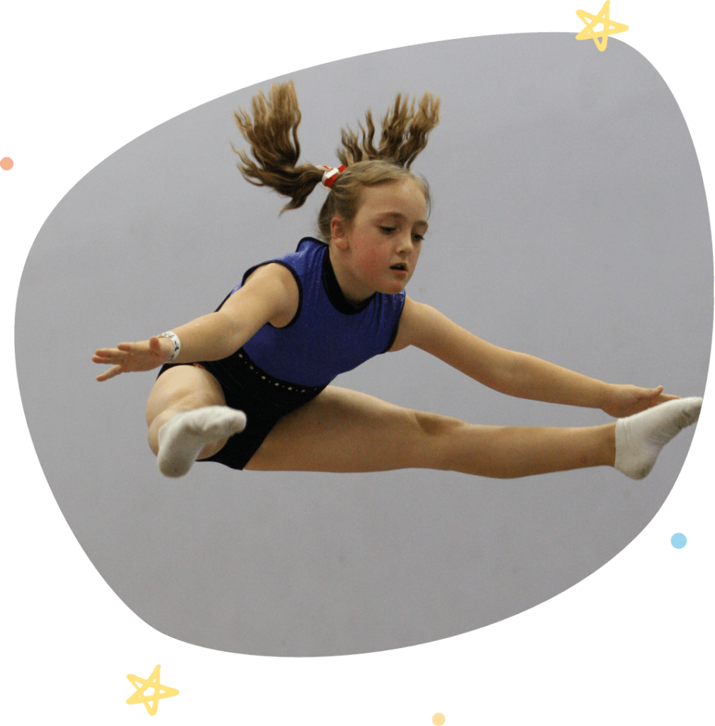 Girl doing straddle jump at her trampolining classes