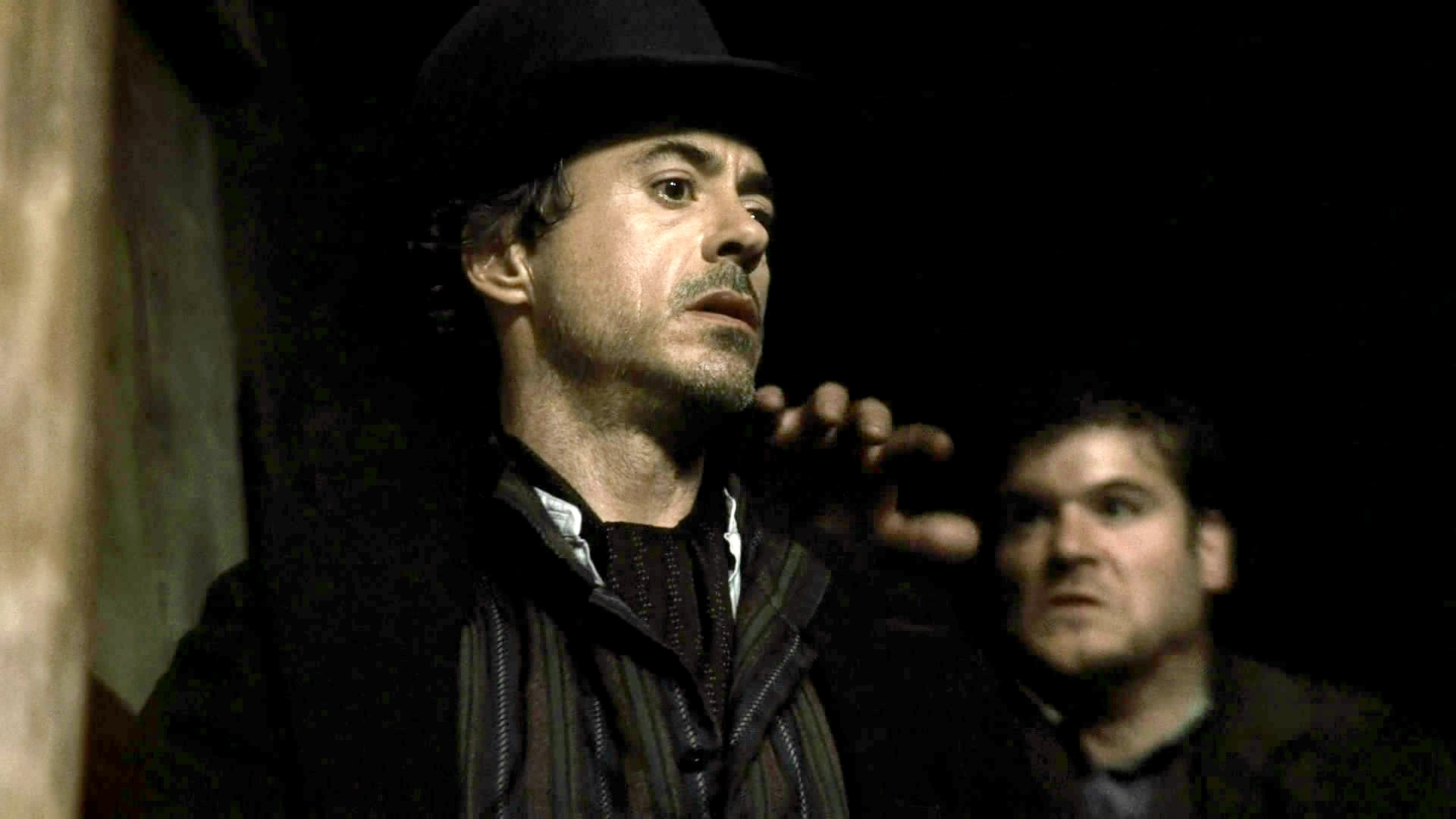 Richard Dwyer the stuntman grabs Robert Downey Junior's shoulder in the Sherlock Holmes movie