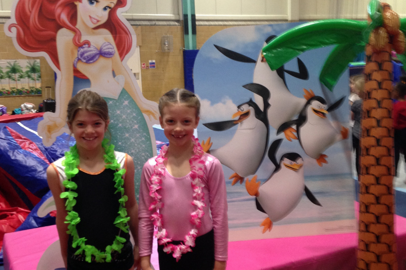 Alice and Aila at 'Under the Sea' Camp - two children wearing leis