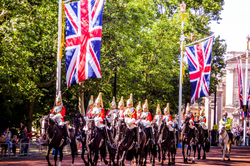 Soldiers on horses and union jack flags at Pall Mall