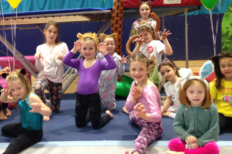 Emmy and Aila in the jungle! - Children wearing animal head dresses at gymnastics club
