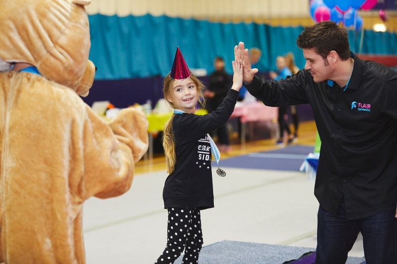 Child high fives Flair Founder Richard Dwyer at gymnastics competition - why some parents got upset at the latest series of 'Child Genius'