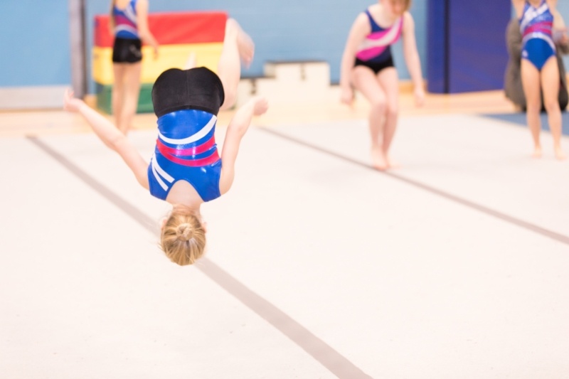 8 Reasons To Join The Display Squad - Child in gymnastics class mid somersault