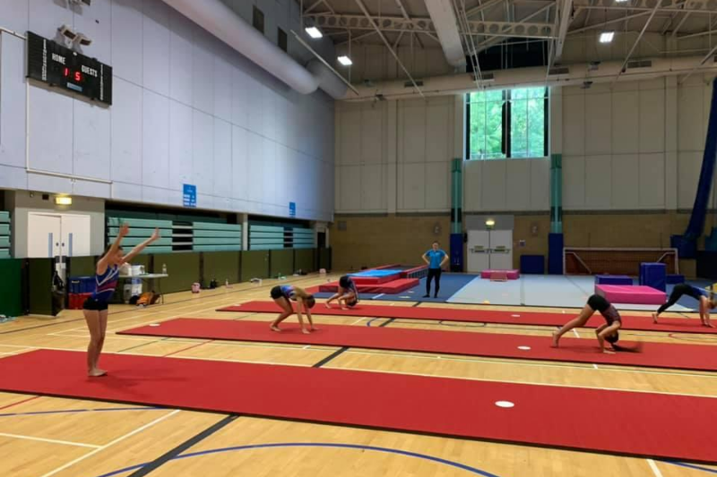 Practising lines safely distanced at a gymnastics club in Surrey