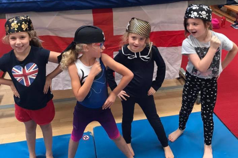 Four children dressed as pirates at their gymnastics club